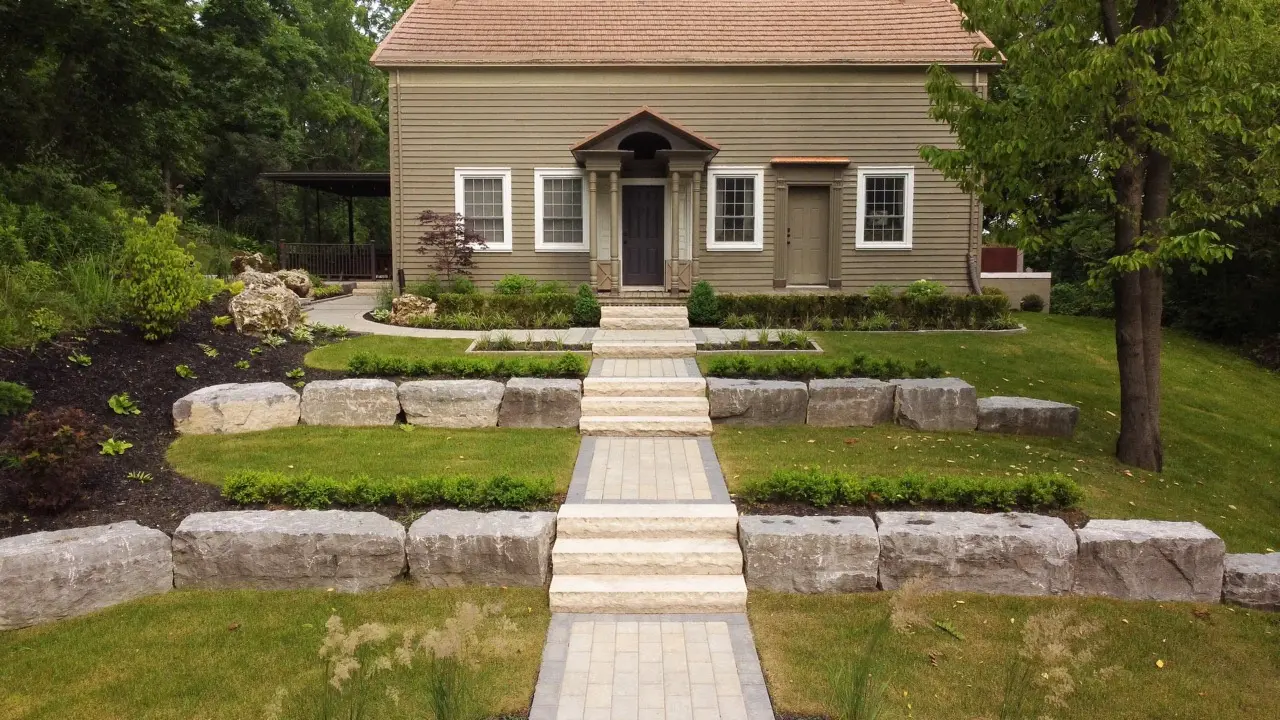 Terraced Layers of Armourstones with Gardens and Stone Paths invite the Visitor with grace and style